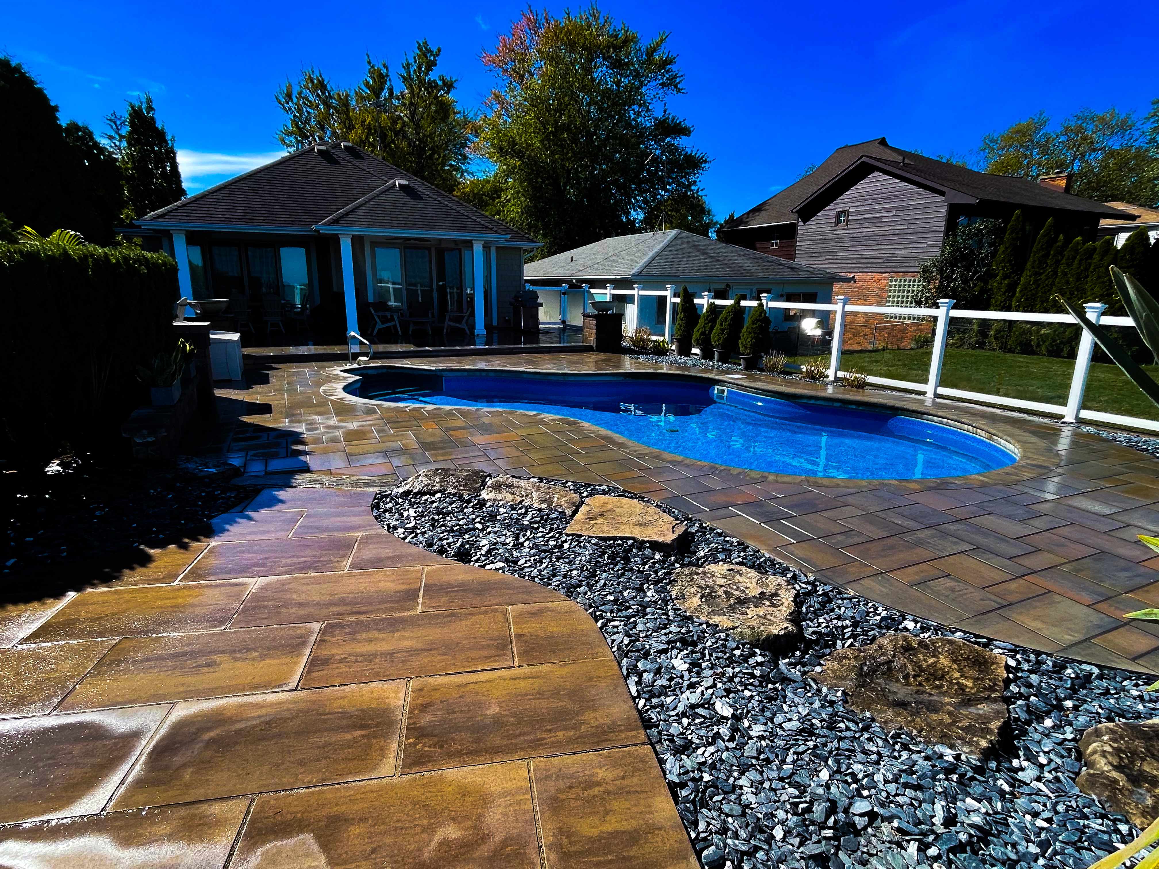 Luxury pool area with custom stone landscaping