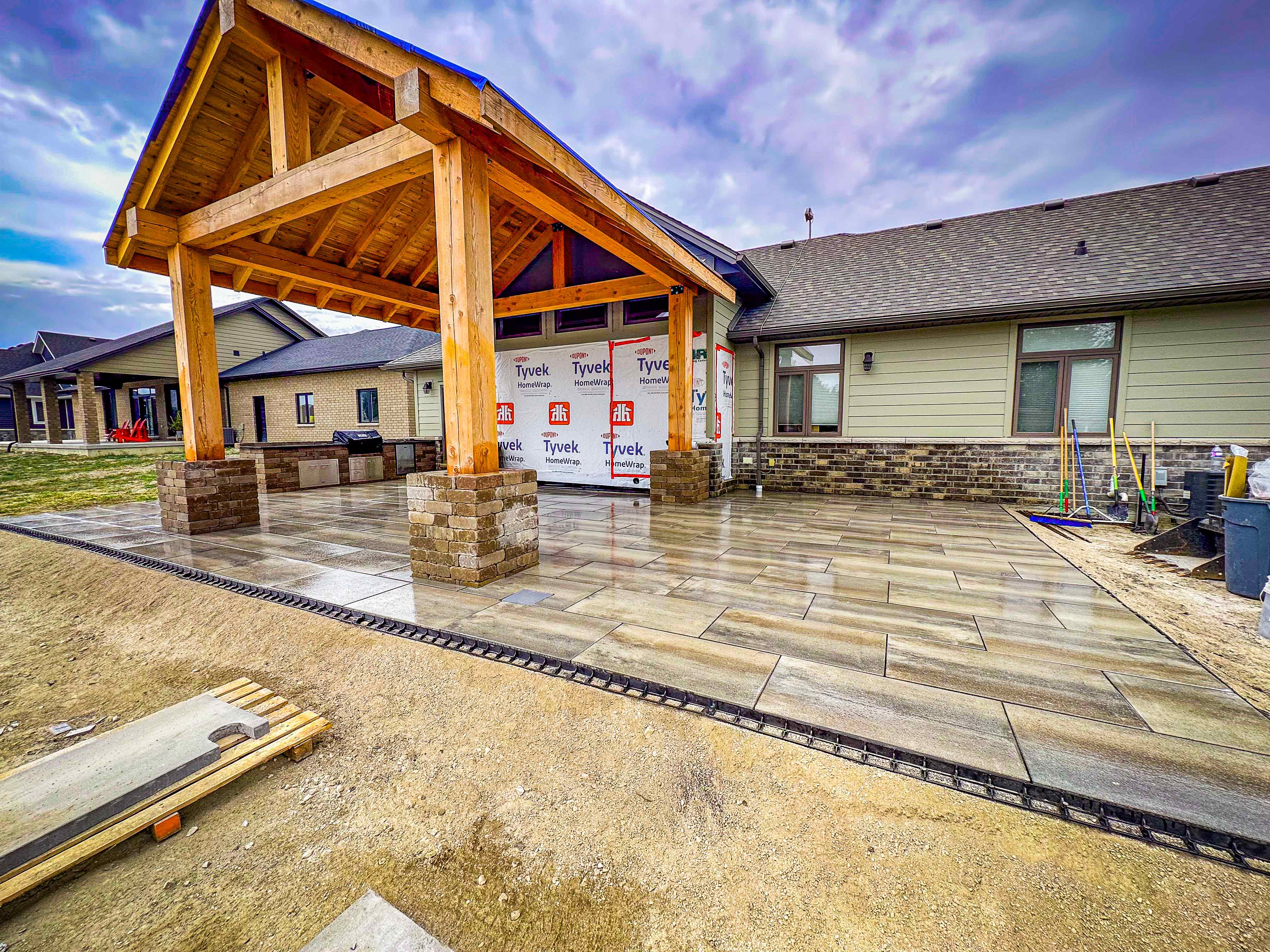 Timber frame pergola construction with stone work